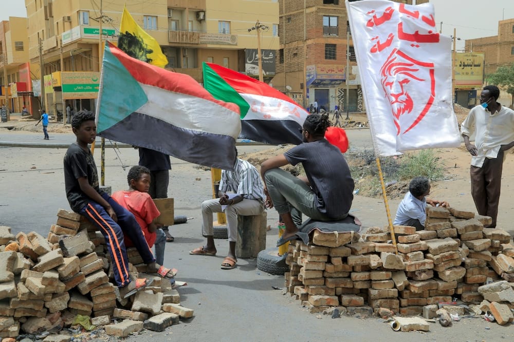 Protesters man a roadblock in the Sudanese capital Khartoum on July 4