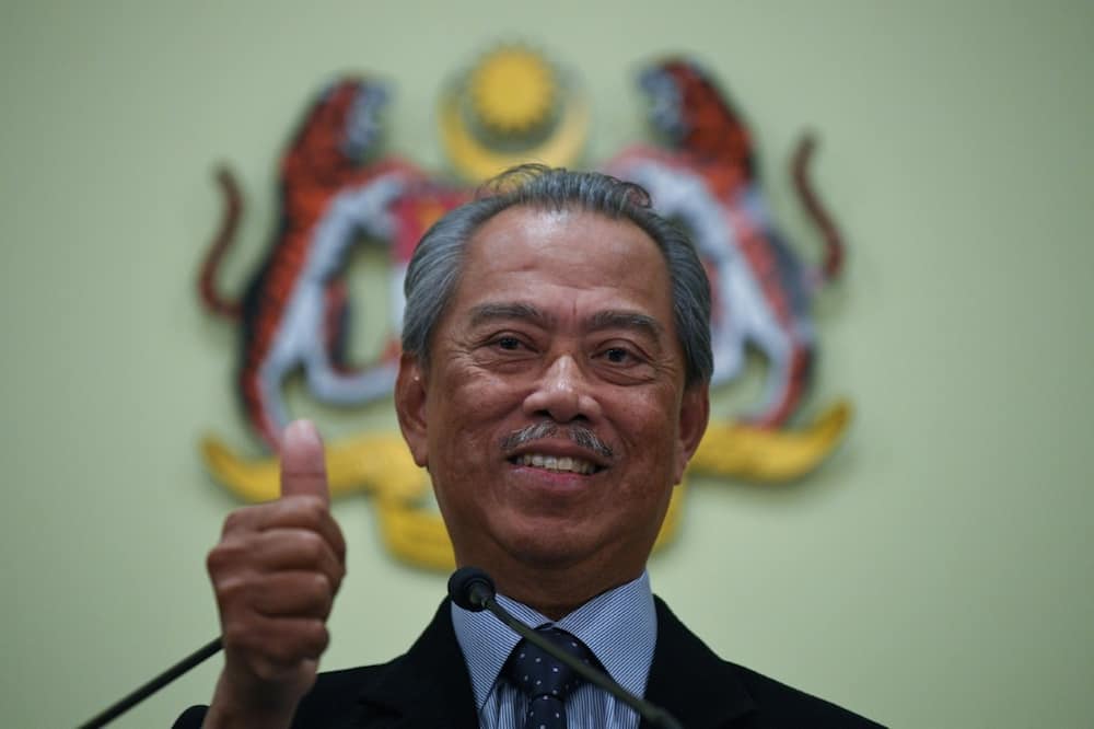 Former premier Muhyiddin Yassin, seen here in 2020, and opposition leader Anwar Ibrahim both claim they have the numbers to form a coalition government in Malaysia