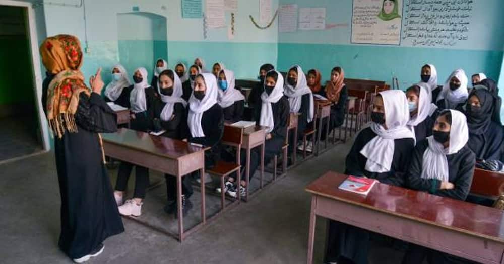 Girls attend a class.