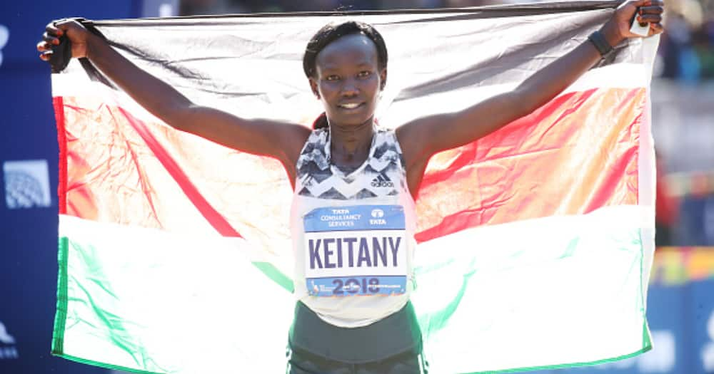 Women's division winner Mary Keitany of Kenya celebrates at the finish line during the 2018 TCS New York City Marathon November 4, 2018 in New York City. (Photo by PhotoRun/New York Road Runners via Getty Images)