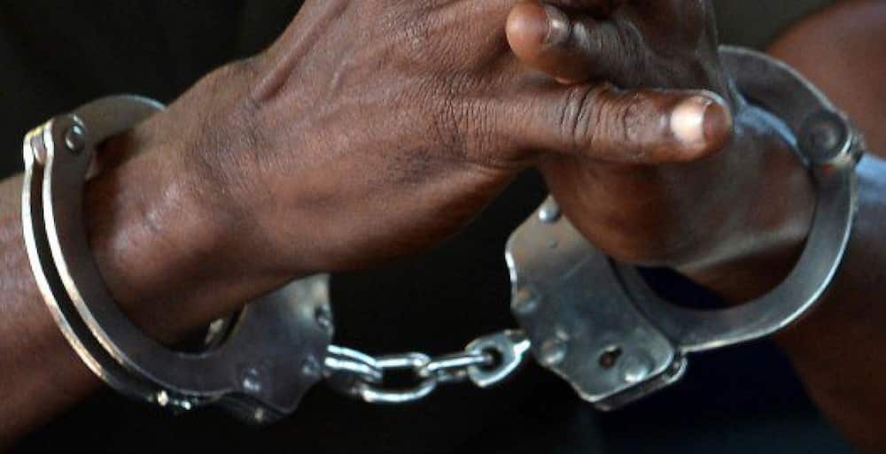 Hands with handcuffs. Photo: Kenya Police