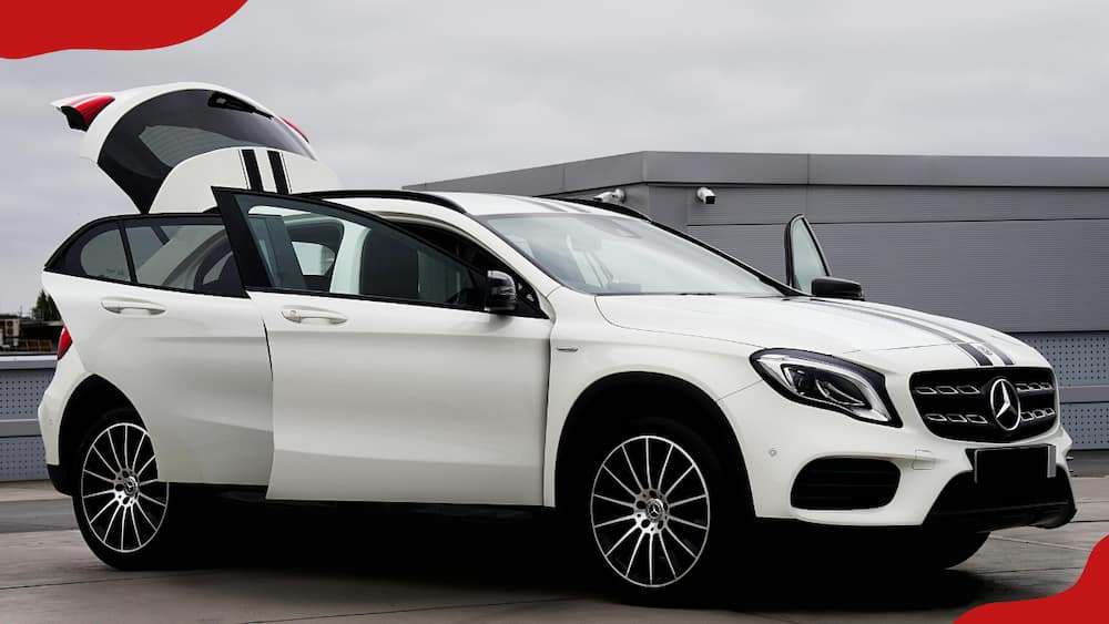 A white Mercedes-Benz GLA with opened doors