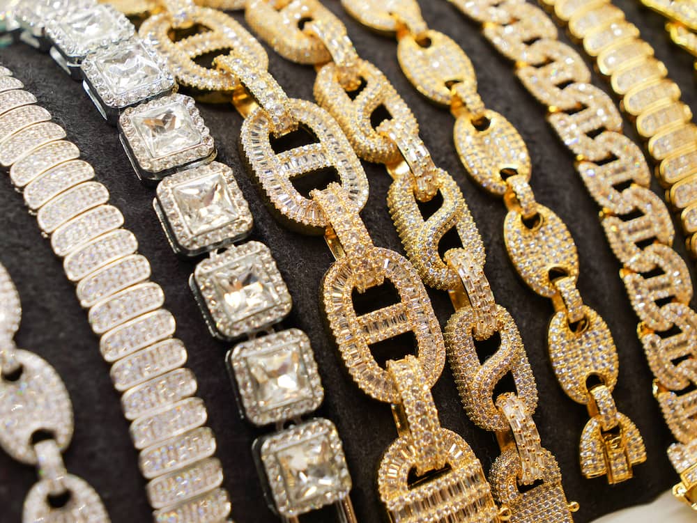 Traditional bracelets and necklaces with diamonds in a row on display