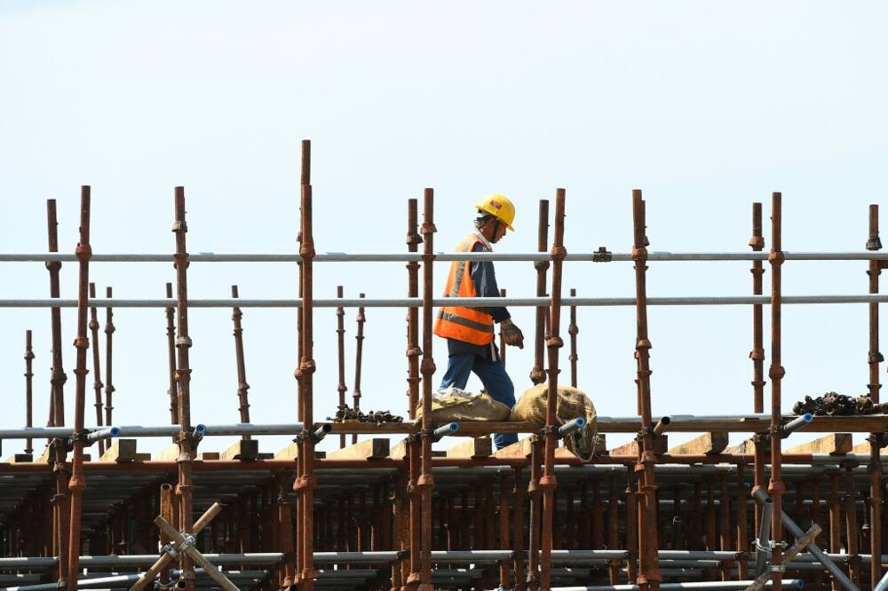 A Chinese laborer works at a construction site on reclaimed land in February 2020, part of a Chinese-funded project in Colombo, Sri Lanka