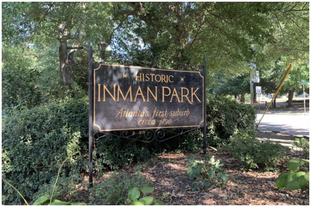 The famous 'Welcome to Inman Park' sign greets people as they enter the neighbourhood. The signage is located at multiple locations throughout the Inman Park.