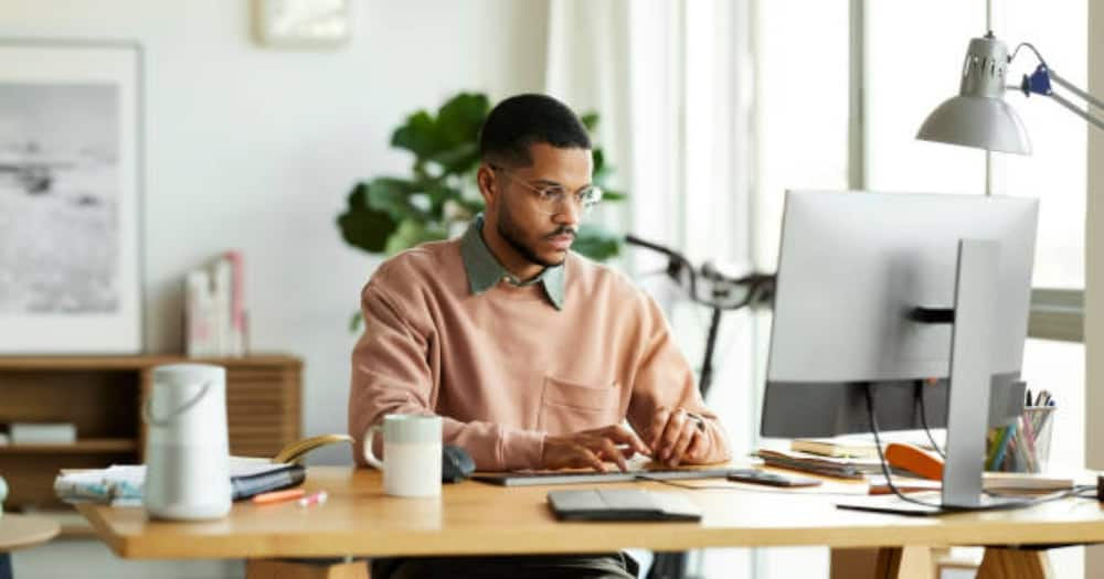 Man in an office working. Photo: Getty Images.