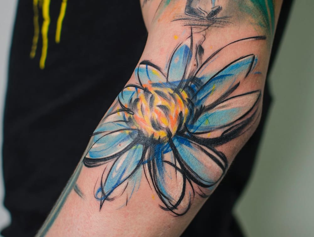 A blue daisy tattoo design