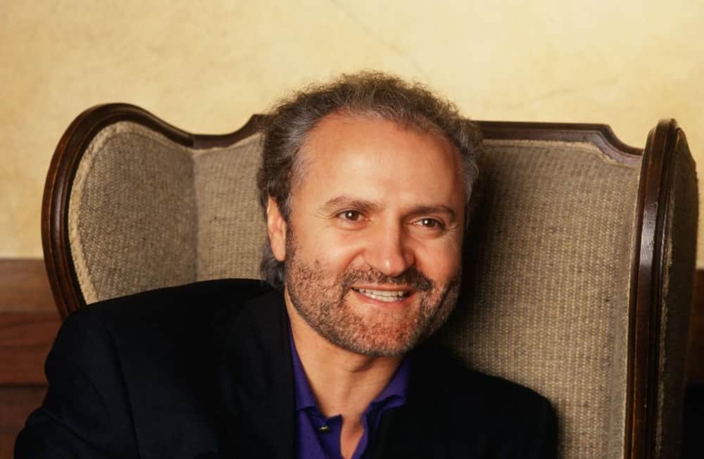 The late Gianni Versace poses for a photo