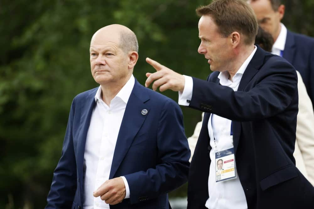 German Chancellor Olaf Scholz (L) said the invitation to the five emerging powers signalled that the community of democracies is not limited to the West or to countries in the northern hemisphere
