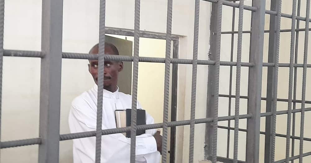 Pastor Ezekiel behind bars.