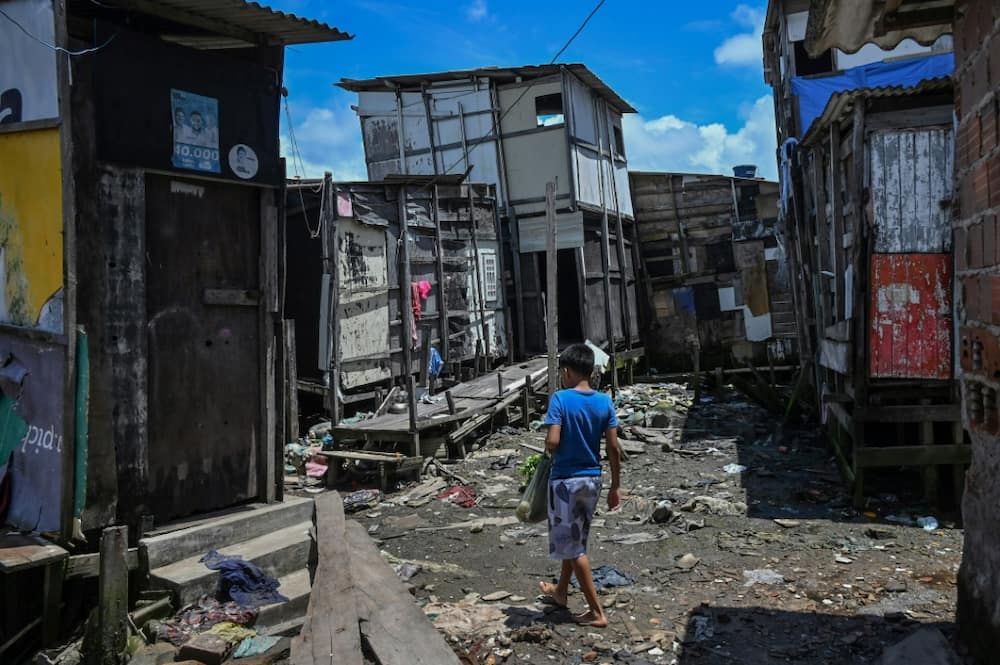 Children are among the worst affected by extreme poverty, which is rising across Latin America and the Caribbean. Here, a child walks through a favela in northeastern Brazil.