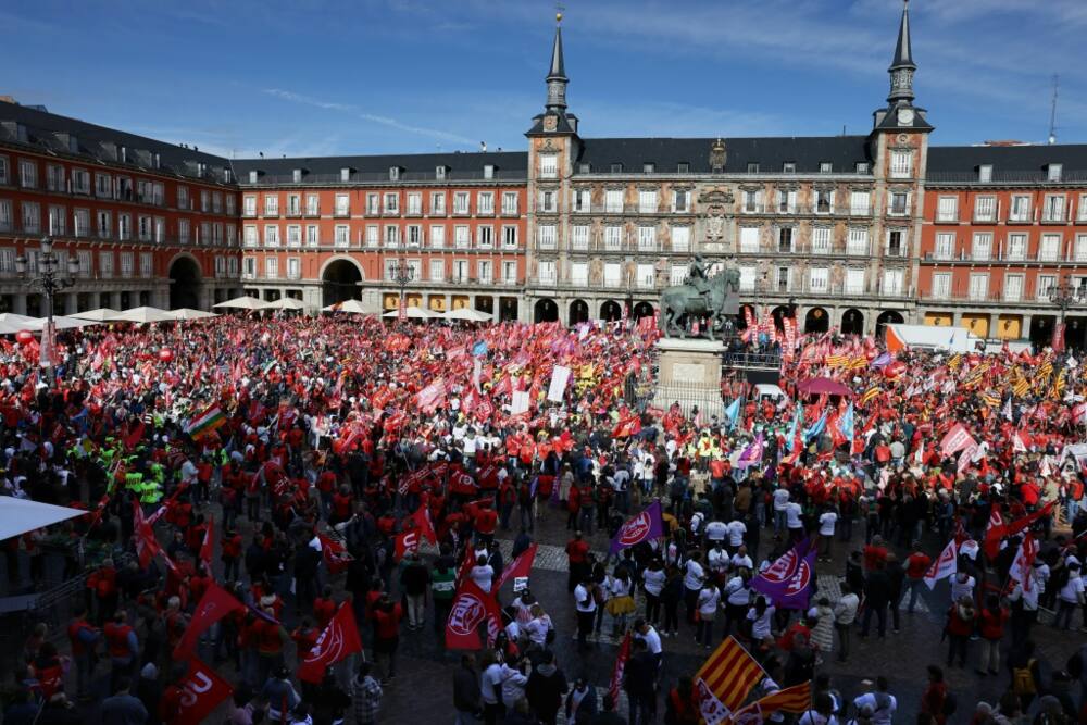 Thousands of people packed Madrid's landmark Plaza Mayor to demand higher pay