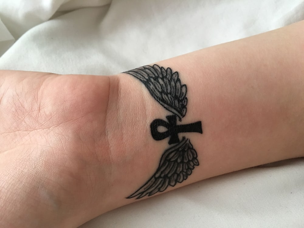 20 cutest wrist angel wings tattoo ideas with their meanings