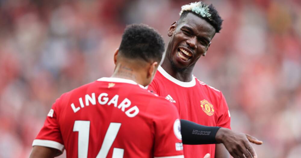 Jesse Lingard celebrates with Paul Pogba after scoring their side's fourth goal during the Premier League match between Manchester United and Newcastle United at Old Trafford. (Photo by Clive Brunskill/Getty Images)