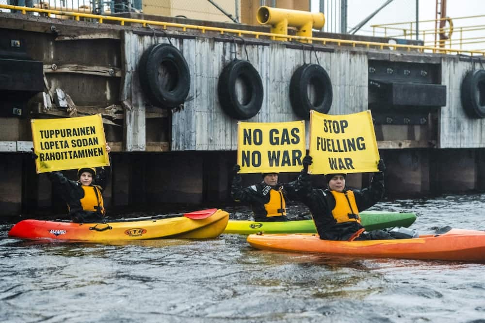 Greenpeace activists seek to block a Russian gas shipment from being offloaded in Finland on September 17, 2022