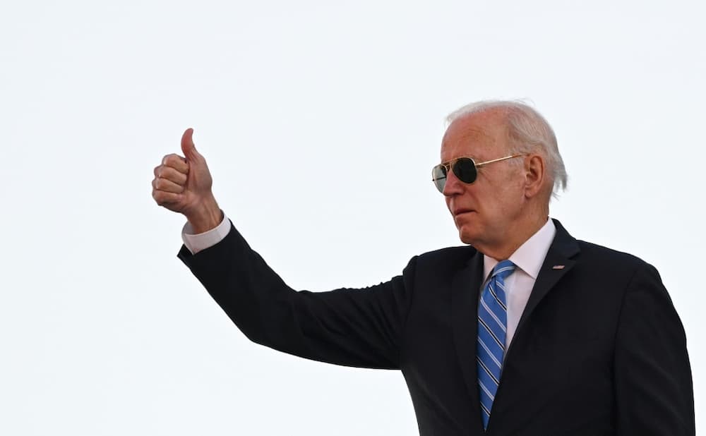 US President Joe Biden gives a thumbs up as he boards Air Force One at John F. Kennedy International Airport in New York