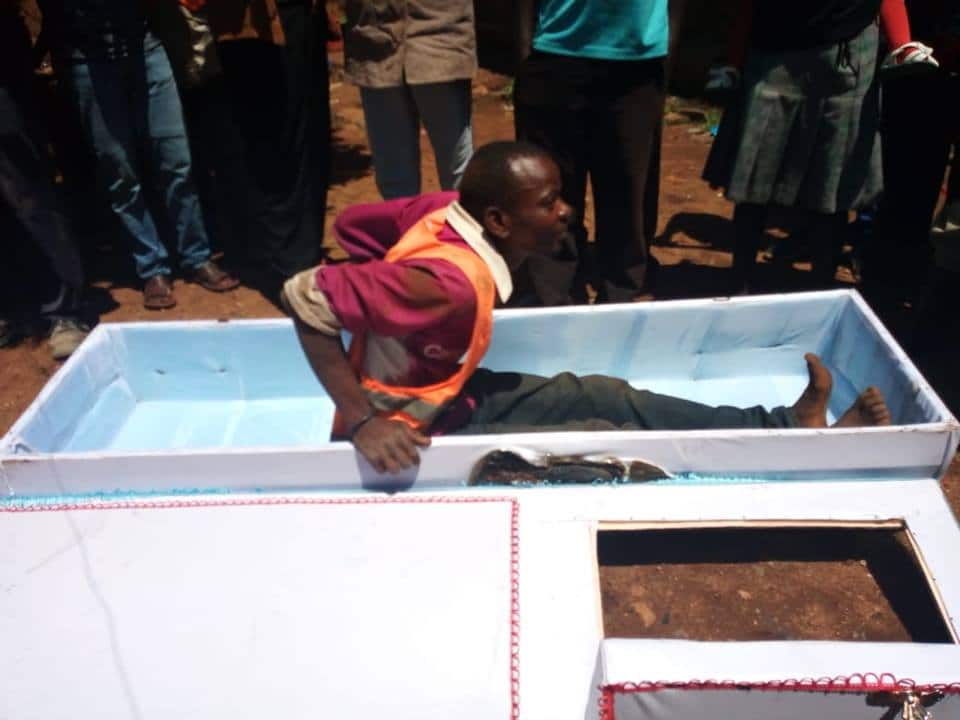 Image result for images of Awilo Jasiaya inside a coffin