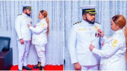 Photos: Lucy Natasha Adjusts Hubby Carmel's Coat as Couple Step out In Matching Military-Like Outfits