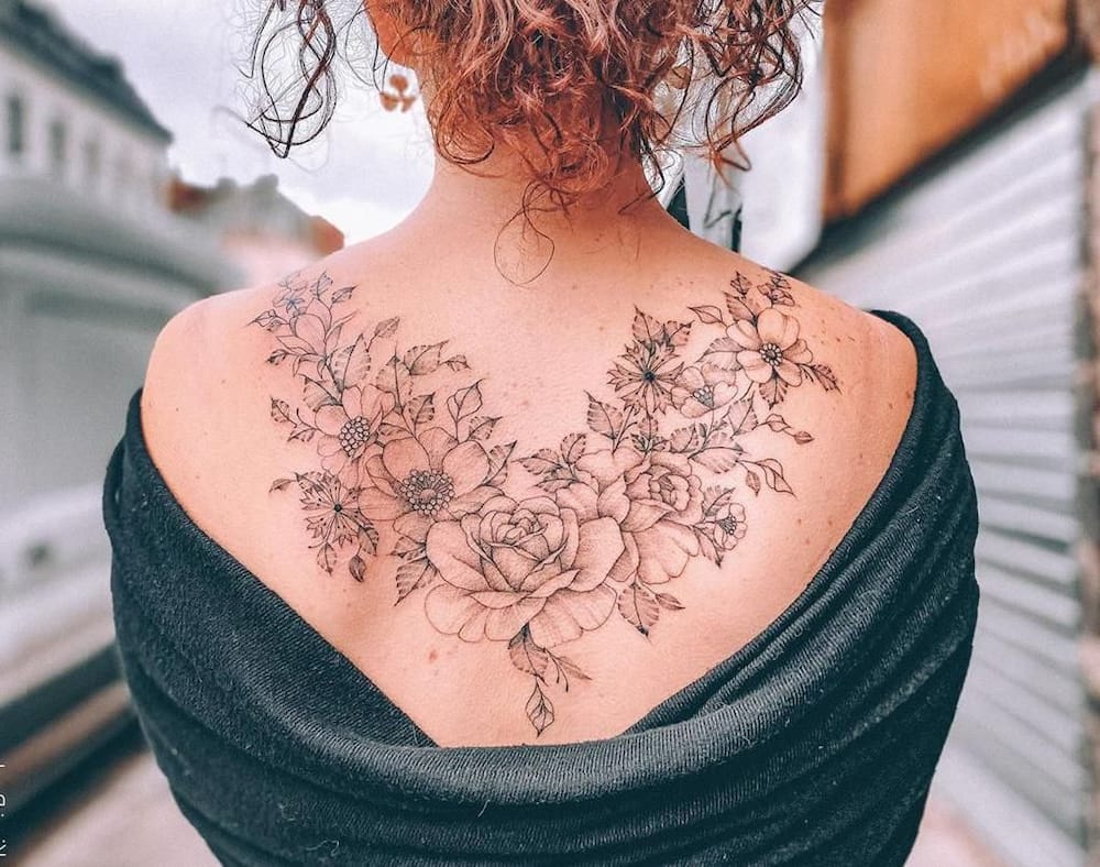 Upper back floral tattoo