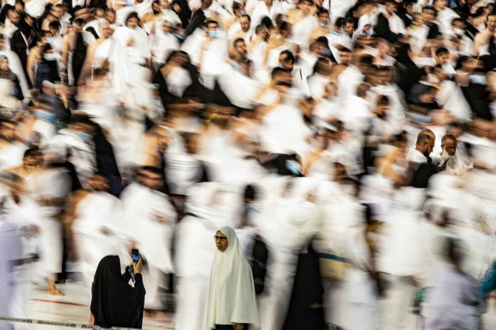 Many of the worshippers on the hajj on Thursday set off on on foot to Mina, seven kilometres (four miles) from Mecca's Grand Mosque