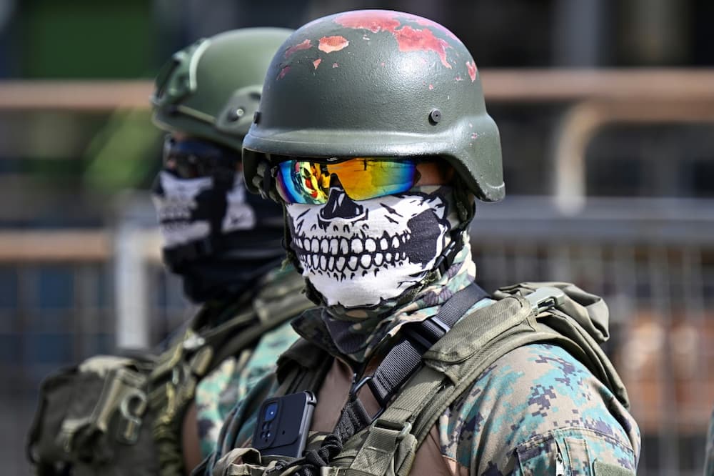 Ecuadoran soldiers guard the perimeter of the Guayas 1 prison amid disturbances there on November 4, 2022