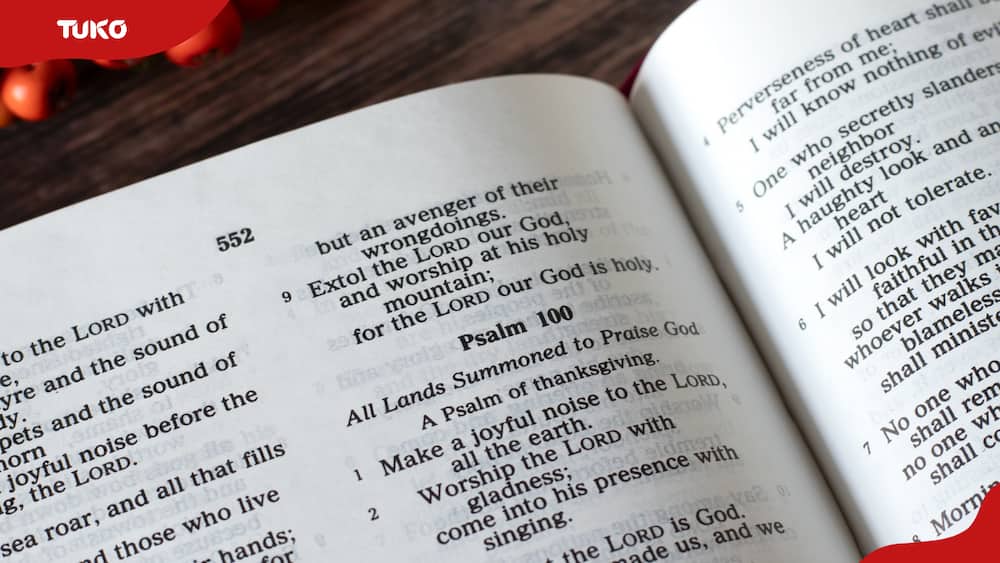 An open Bible with Psalms 100 in view