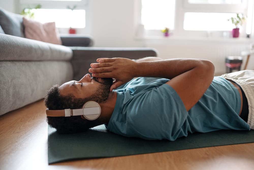 A man is listening to meditation music