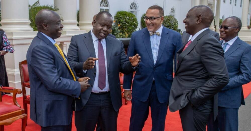 Outgoing Cabinet Secretaries share a light moment with President William Ruto and DP Rigathi Gachagua.