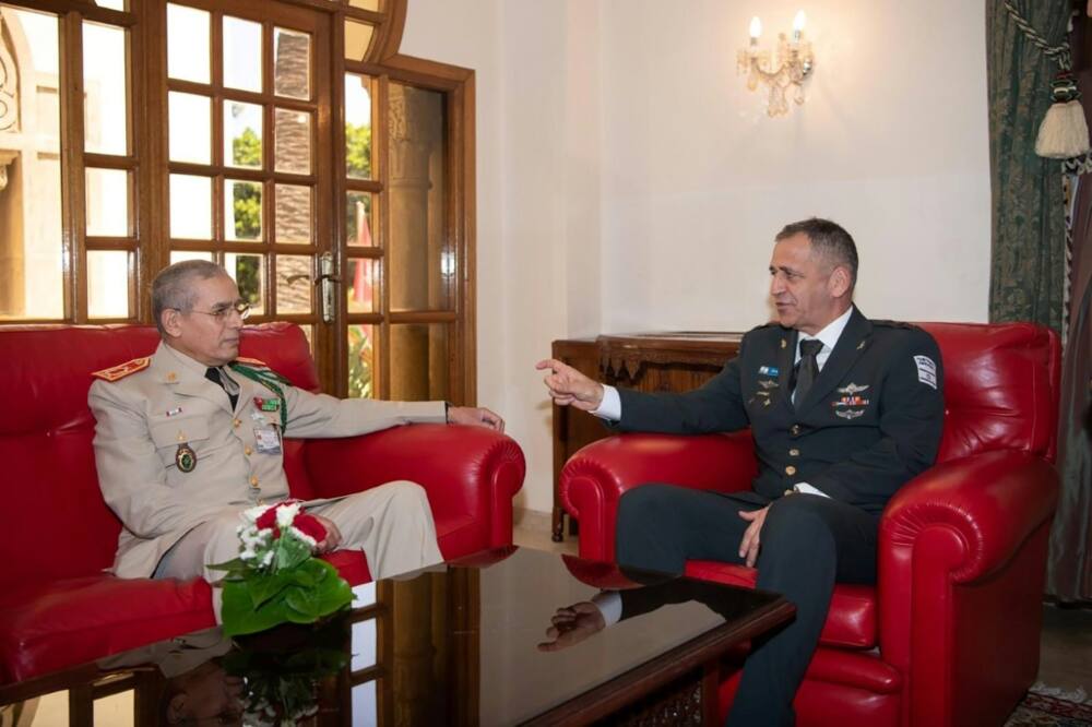 This handout picture released by the Israeli army shows Chief of Staff Aviv Kohavi (R) meeting with his Moroccan counterpart Belkhir El-Farouk at the Royal Moroccan Armed Forces (FAR) in Rabat on July 19, 2022