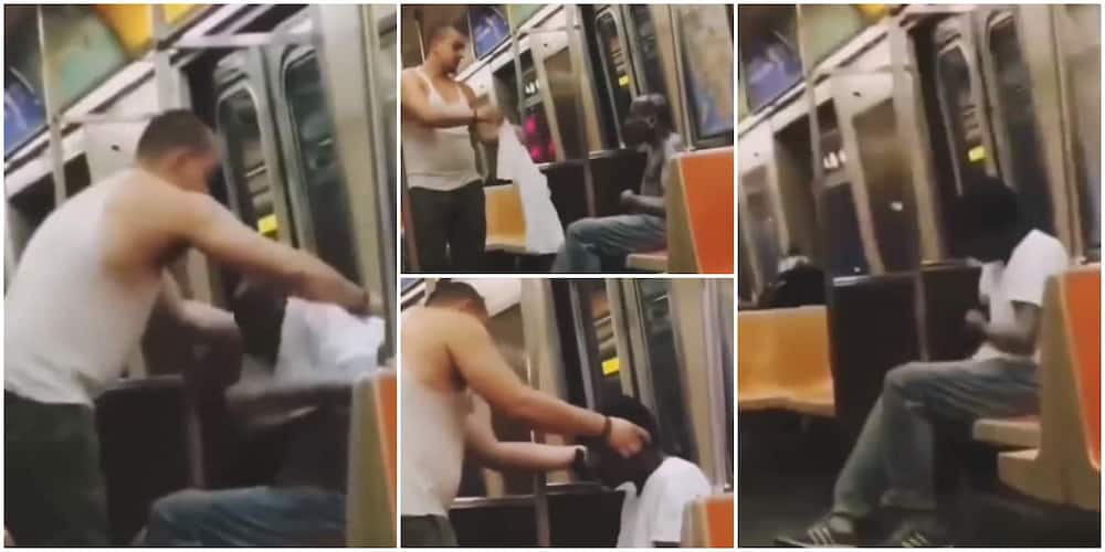 Reactions as a man takes off his shirt and cap, wears it on cold stranger without cloth on a train in touching video.