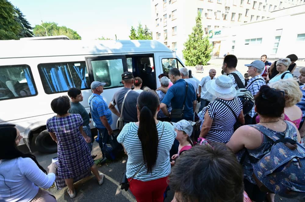 Residents of the city of Sloviansk and neighbouring towns wait for buses to evacuate them to the city of Dnipro, on Wednesday