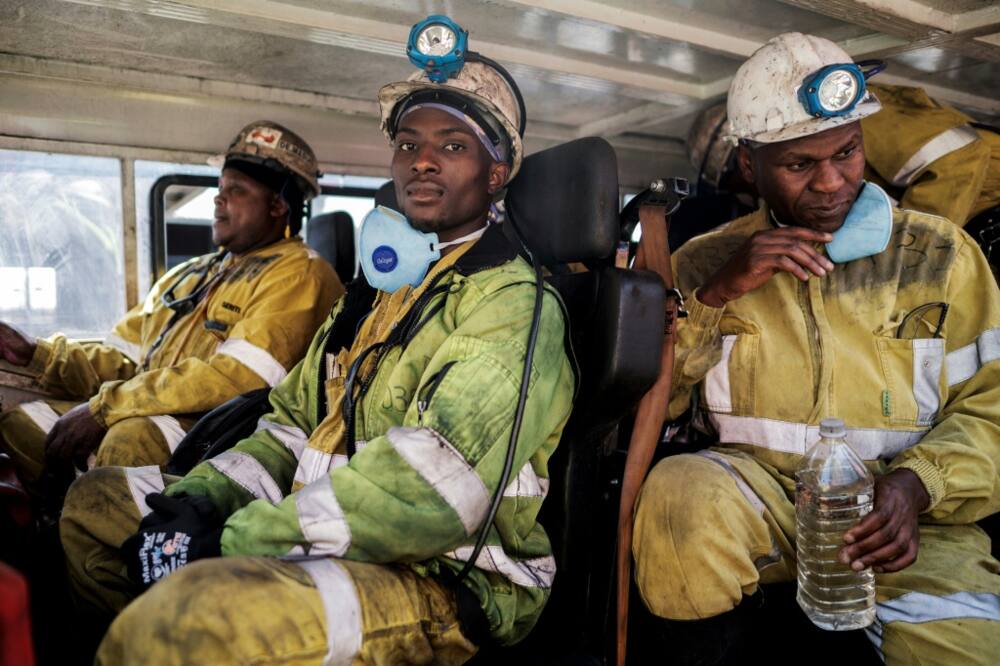 Miners head to work at the Khutala Colliery mine in Kendal, an hour's drive from Johannesburg, in an area known as South Africa's coal belt