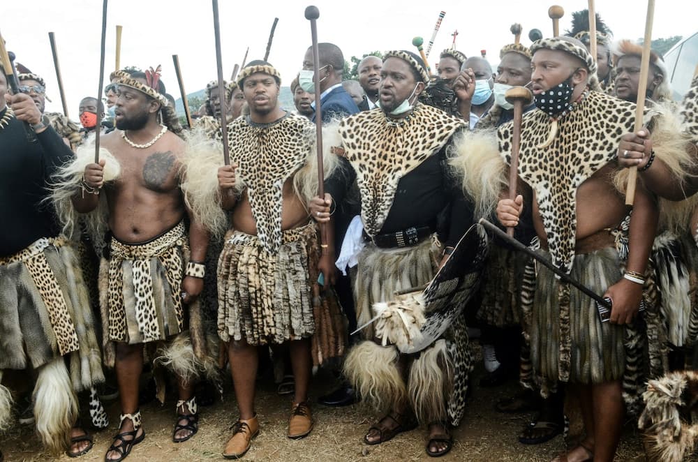 Future king: Prince Misuzulu, second right, arrives with Zulu warriors for the memorial service in May 2021 of his mother, Queen Shiyiwe Mantfombi Dlamini