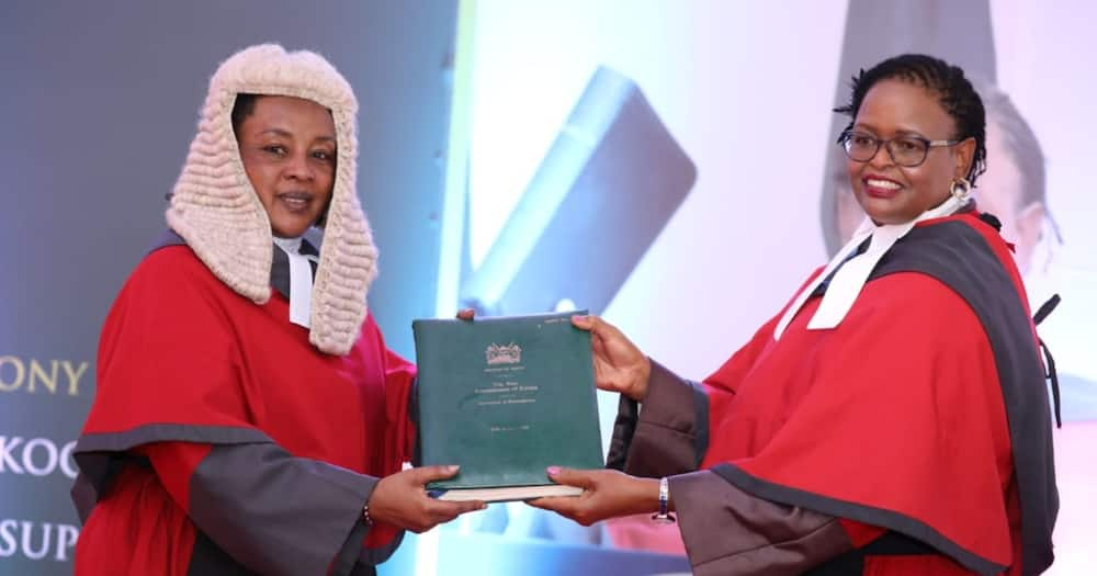 Chief Justice Martha Koome (r) receiving a report of the state of the Judiciary from Deputy Chief Justice Philomena. Photo: The Judiciary.