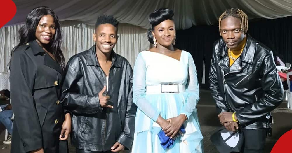 Fred Omondi and his siblings (all in black outfits) pose for a photo with gospel singer Mercy Masika (in blue dress).