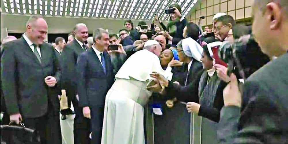 Pope kisses nun week after slapping woman who grabbed his hand