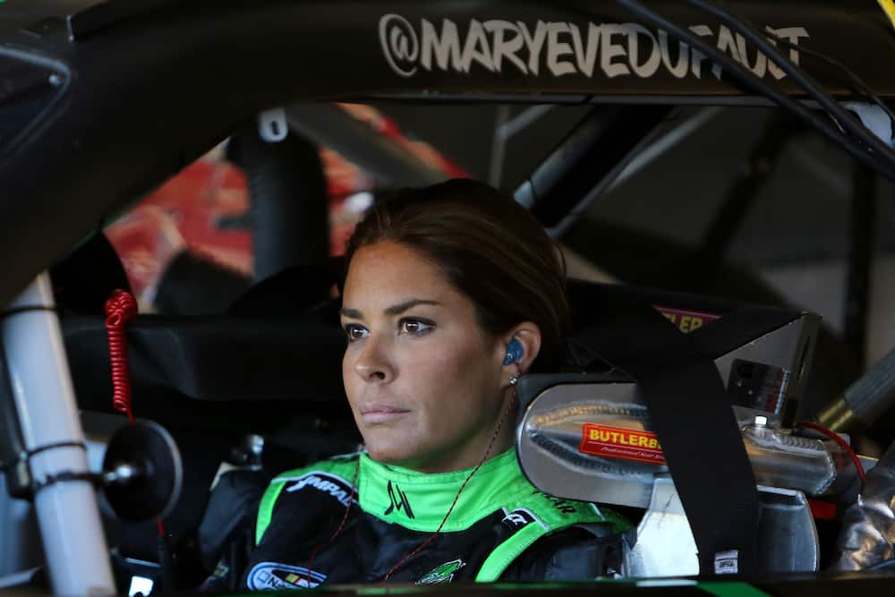 Maryeve Dufault sits in her car during practice for the NASCAR Nationwide Series Dollar General
