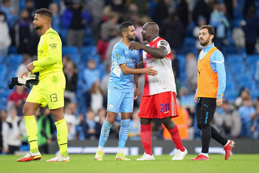 Akinfenwa in action against Man City.