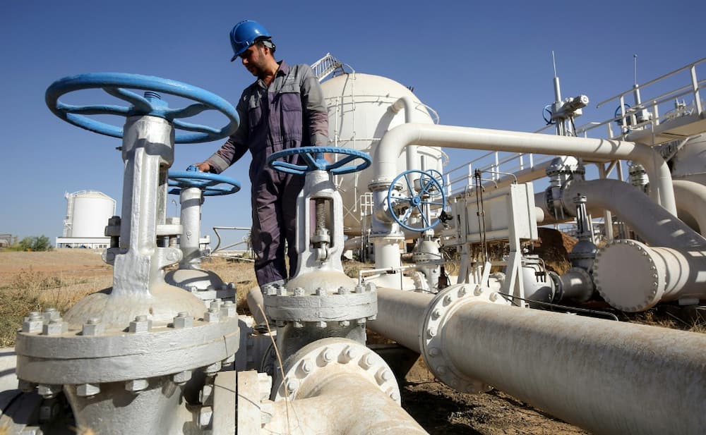 An Iraqi oil employee checks pipelines at the Bai Hassan oil field, west of the northern Iraqi city of Kirkuk in 2017