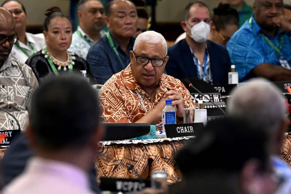 Fijian Prime Minister Frank Bainimarama (C), pictured on July 12, 2022 at the Pacific Islands Forum in Suva, before the arrest of his son in Australia