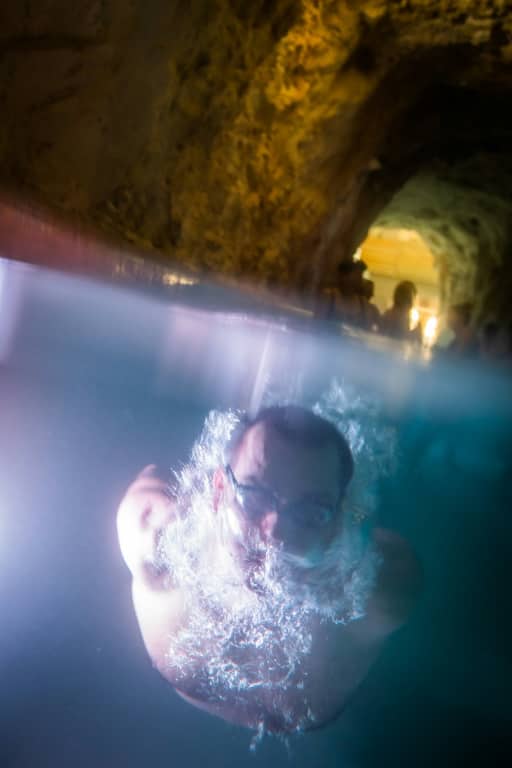 A bather swims in the Miskolctapolca cave spa complex in Hungary