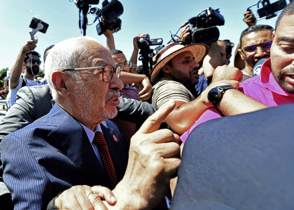 Rached Ghannouchi, head of Tunisia's Ennahda party, arrives at the office of Tunisia's counter-terrorism prosecutor in Tunis on July 19