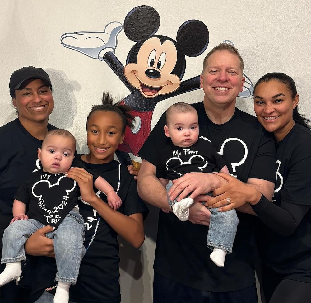 Brianna Johnson poses for a photo with her fiancee, Gary Owen, and kids