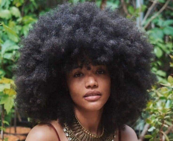 Black woman with curly afro hair