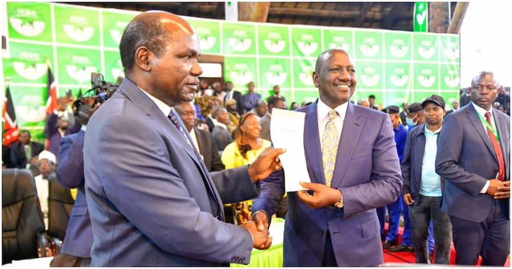 President-elect William Ruto (r) receiving his election certificate from IEBC chair Wafula Chebukati at Bomas of Kenya. Photo: William Ruto.