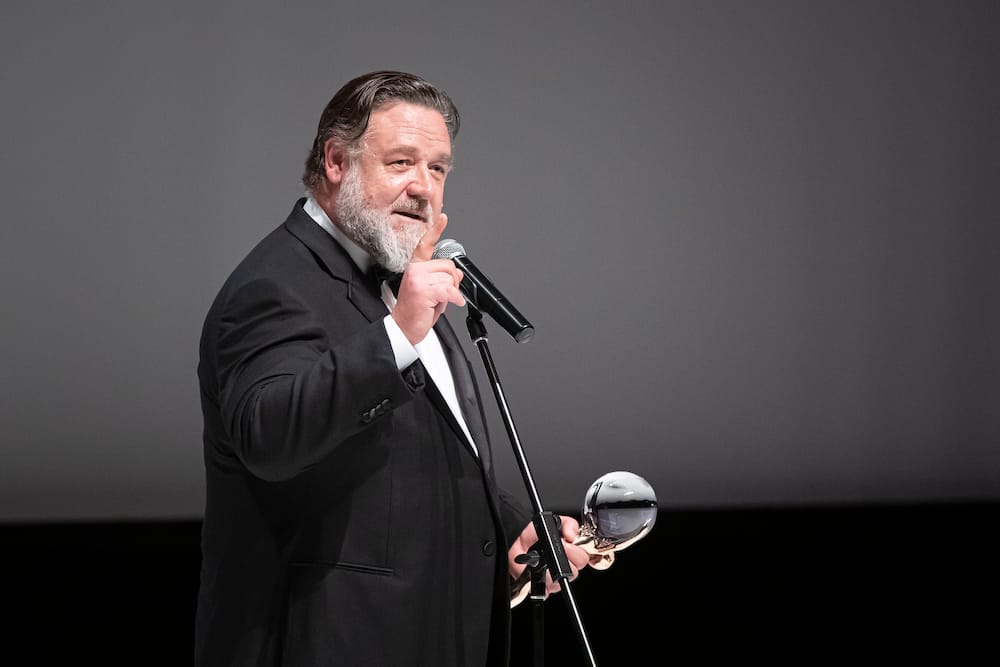 Russell delivers a speech after receiving the Crystal Globe