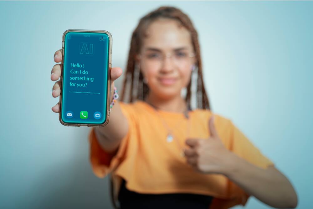 Woman shows her smartphone with the Chatbot interface