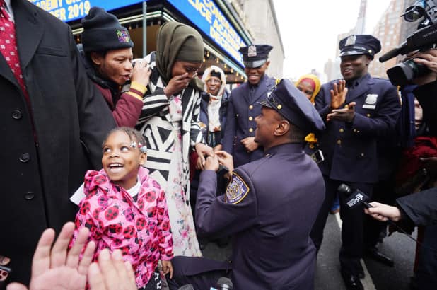 Sweet moment as police officer proposes to girlfriend during graduation ceremony