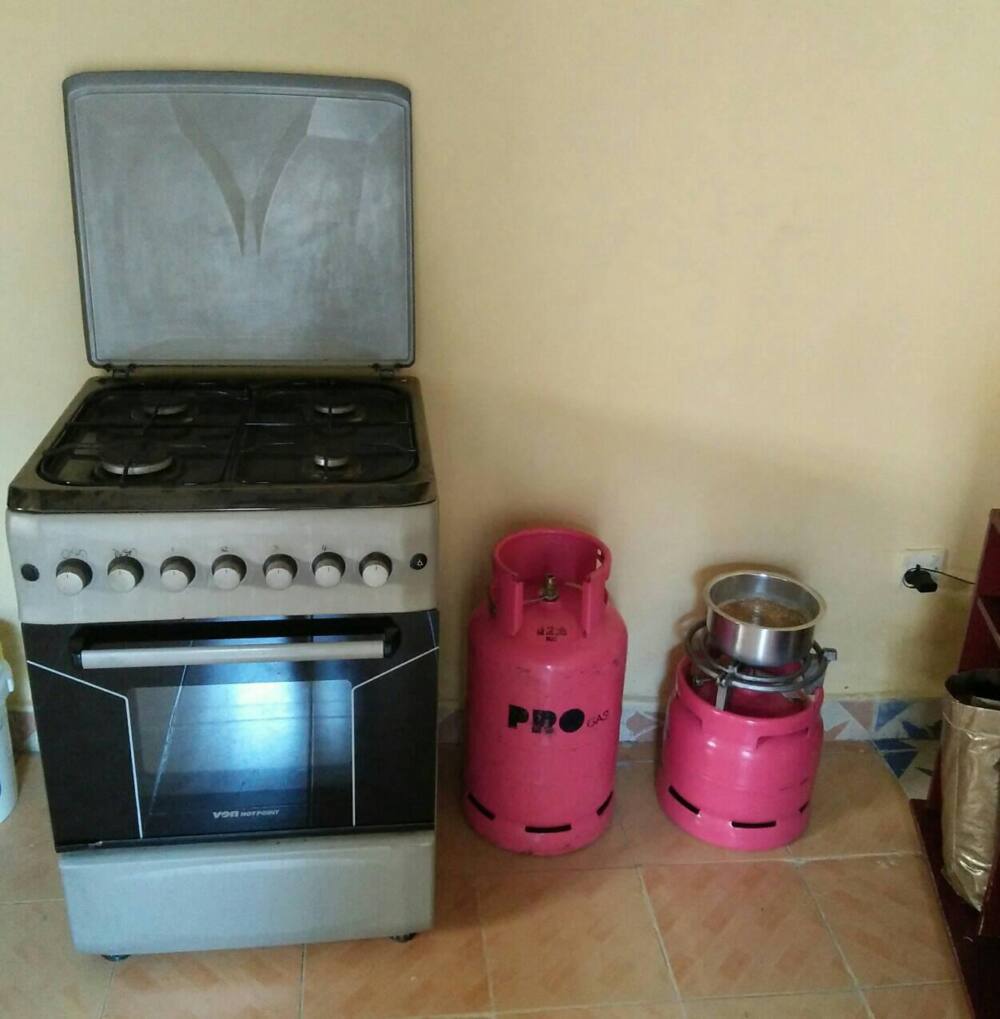 Kenyans comfort former supermarket worker who sold her cooker to put food on the table