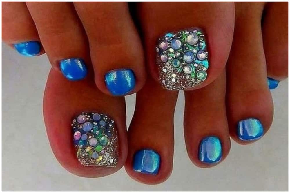 Blue glitter chrome nail design
